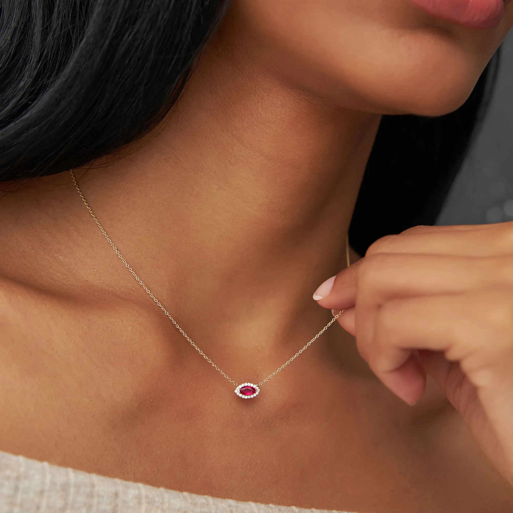 14k Marquise Ruby with Halo Diamond Setting