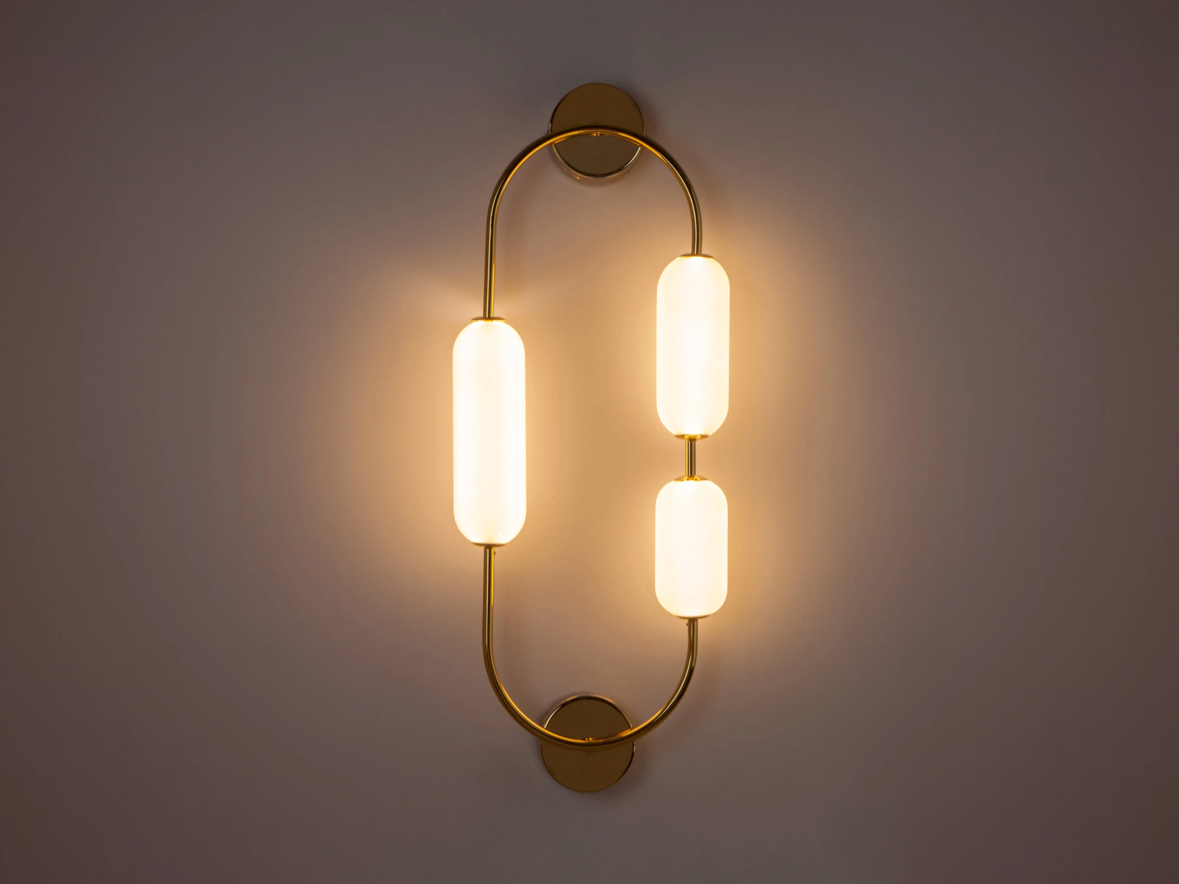Brass oval pill wall light