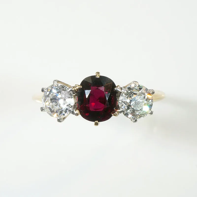 Incredible Ruby in Trilogy Ring with Dazzling Diamonds